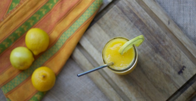 This super delicious version of frozen lemonade is so refreshing on a hot day! It's fruit and honey sweetened for an all natural treat too. --- The Nourishing Gourmetv