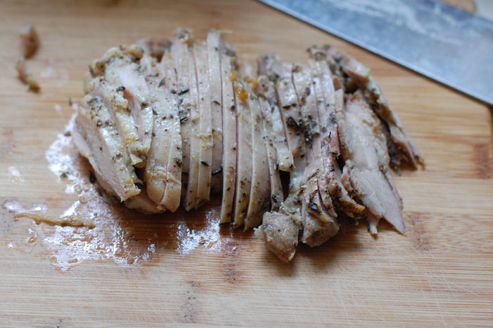 Chicken thighs flavored with herbs, garlic, and lemon peel are thinly sliced for a homemade lunch meat that is also easy to freeze! --- The Nourishing Gourmetv