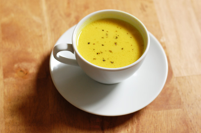 This golden broth is flavored and colored by bright turmeric, ginger, with garlic undertones and richness from coconut milk. It's a savory version of "Golden Milk" and so delicious! -- The Nourishing Gourmet